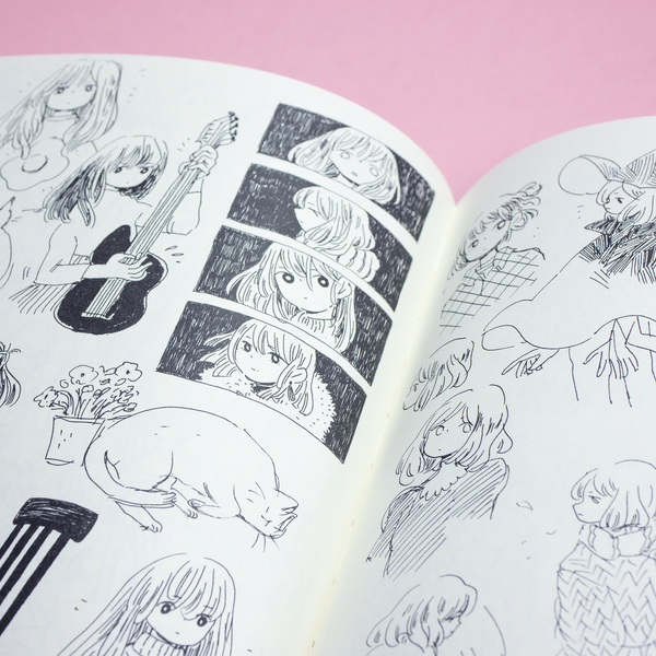 A closeup photo of a spread in The Art of Heikala art book, including images of freehand pen sketches.