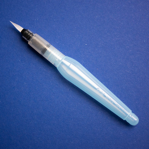 A photo of the white and translucent Pentel Aquash Waterbrush, against a blue background.